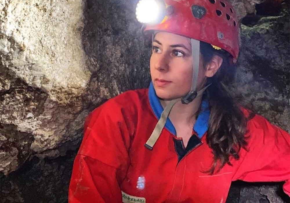 student with headlamp